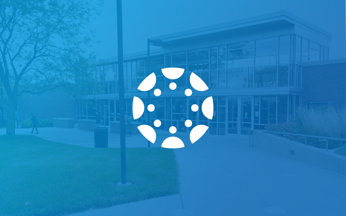 The Canvas logo sits in the center, with a blue background faded just enough to see the image from the Elkhorn Valley campus of Metropolitan Community College